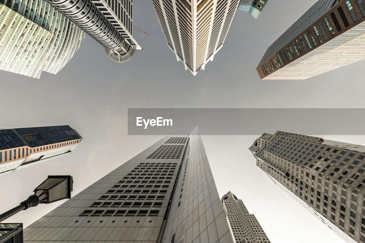 Directly below shot of buildings against sky