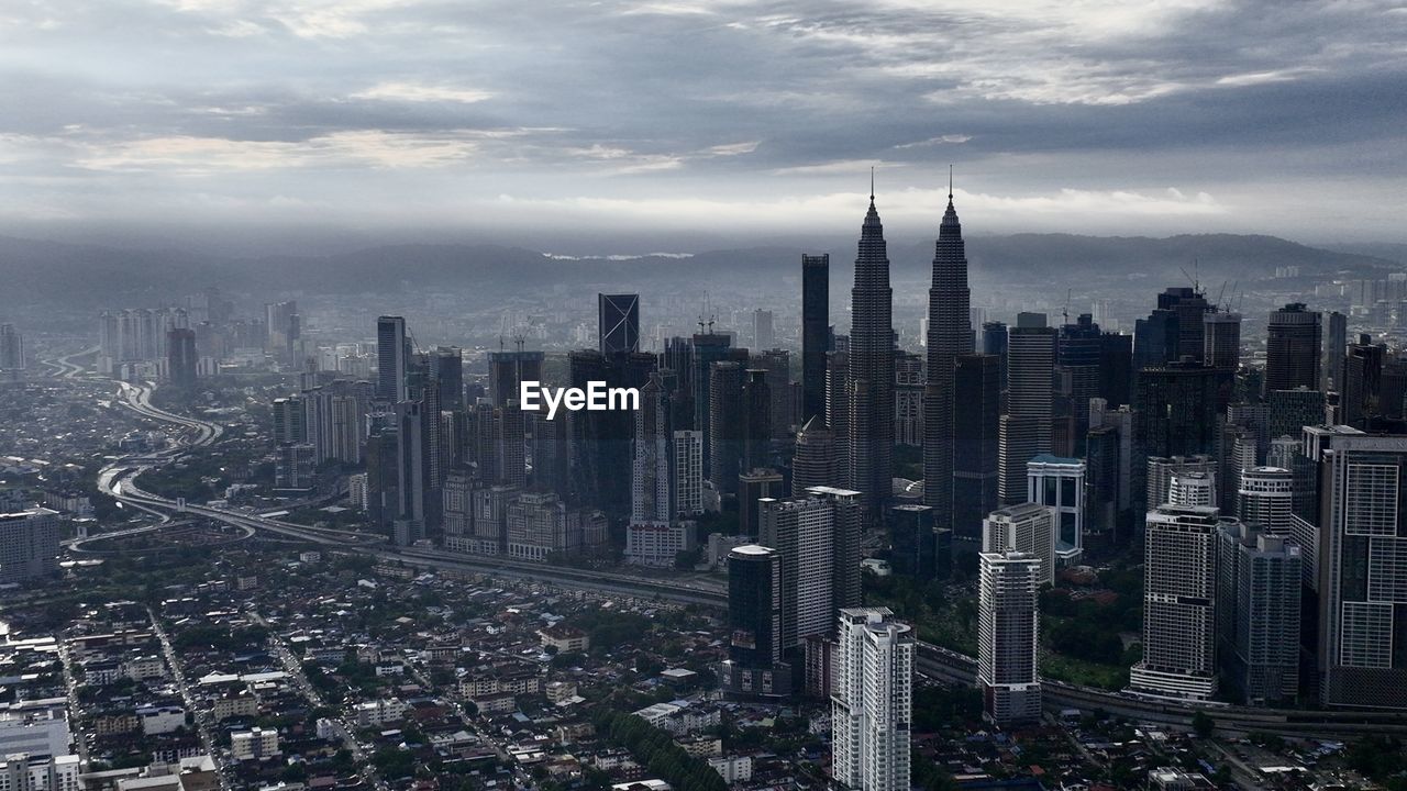 Aerial view of cityscape against sky