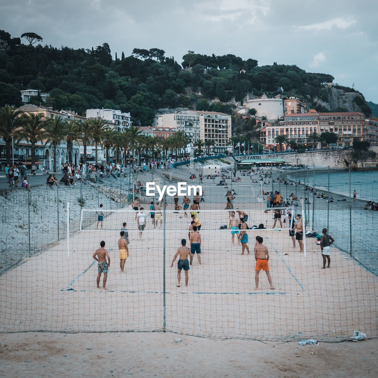 PEOPLE ON SWIMMING POOL AGAINST SKY