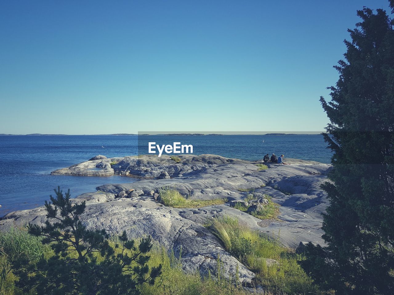 PANORAMIC SHOT OF SEA AGAINST CLEAR BLUE SKY