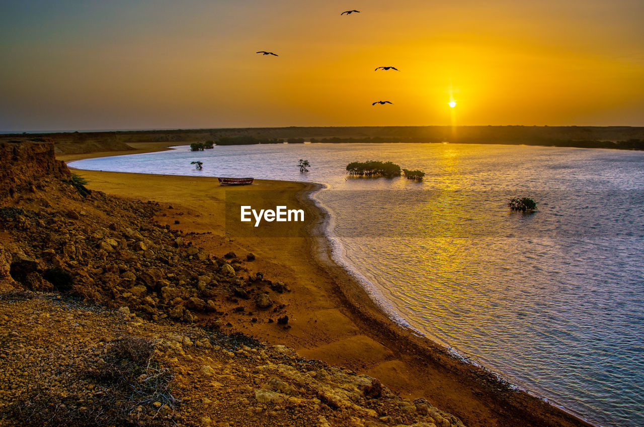 Scenic view of sea against sky during sunset