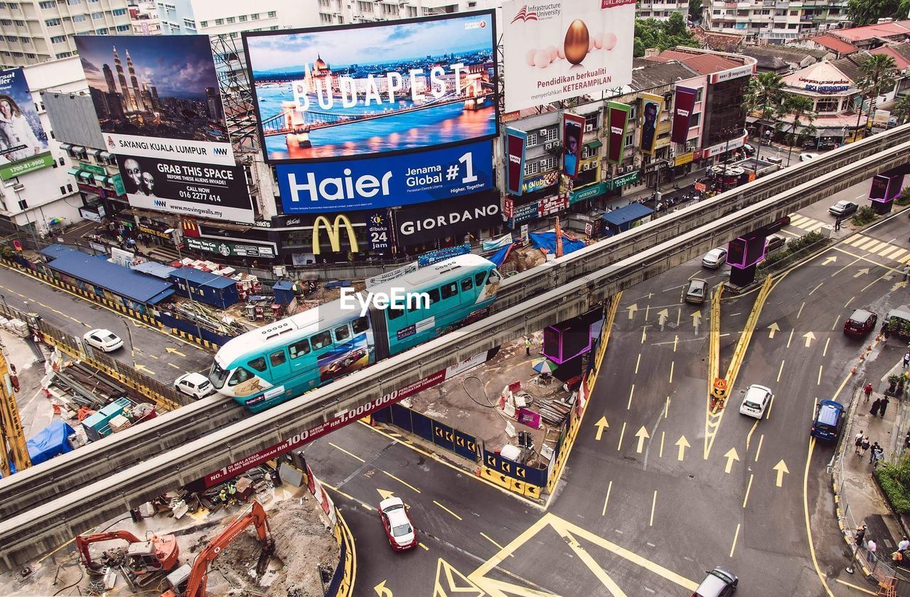 High angle view of monorail above street in city