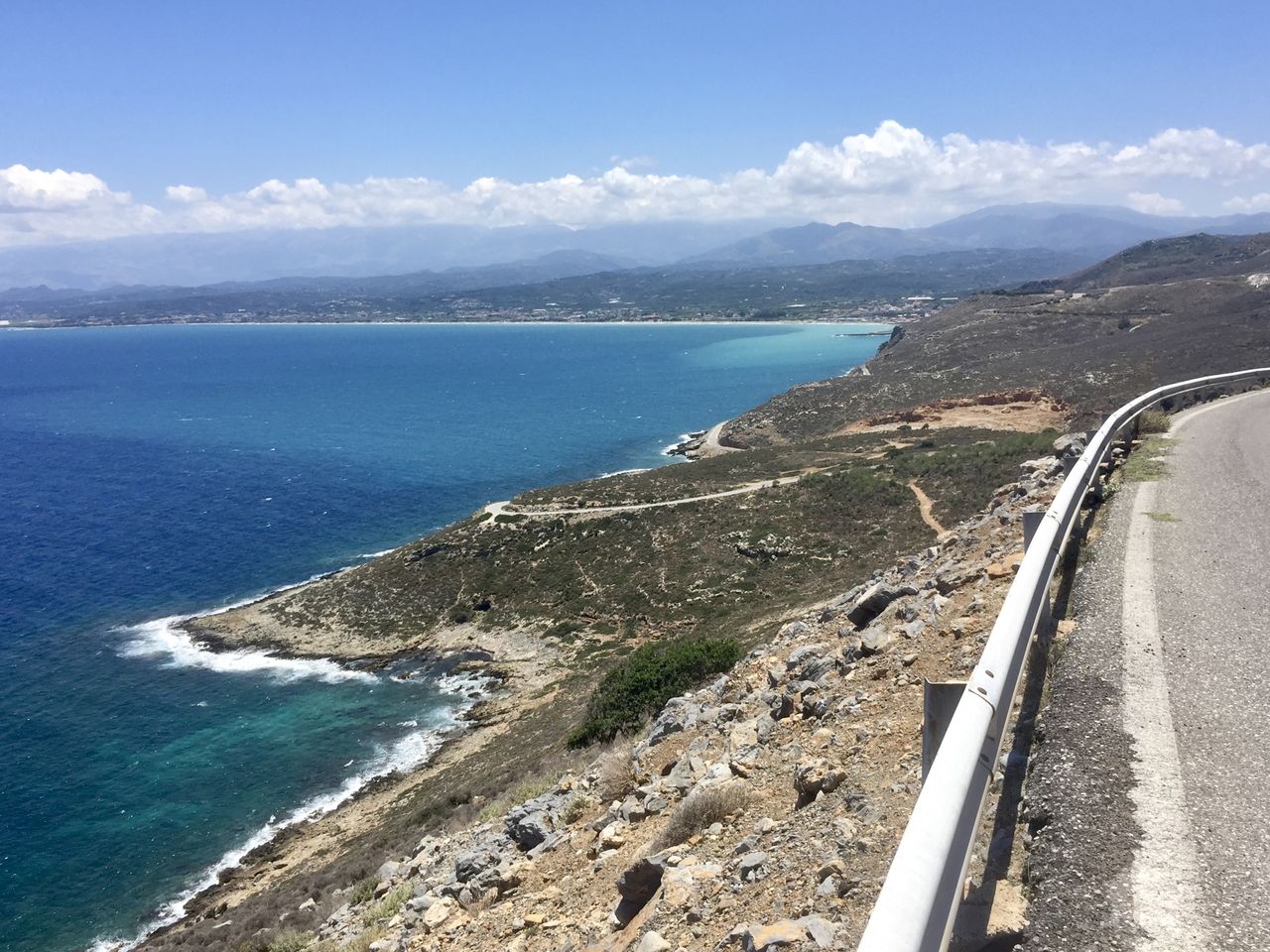 High angle view of road by sea against sky