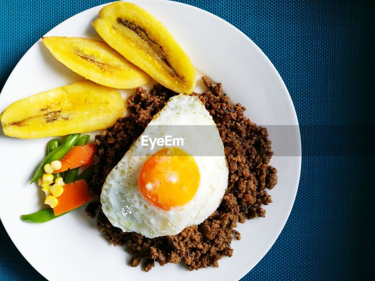 Close-up of breakfast served in plate on table