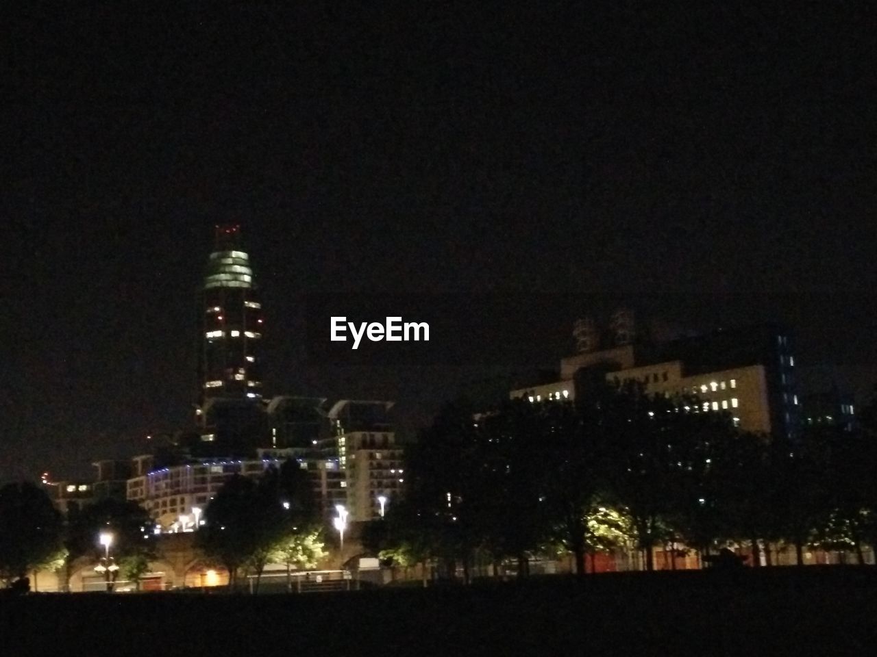 VIEW OF ILLUMINATED CITYSCAPE