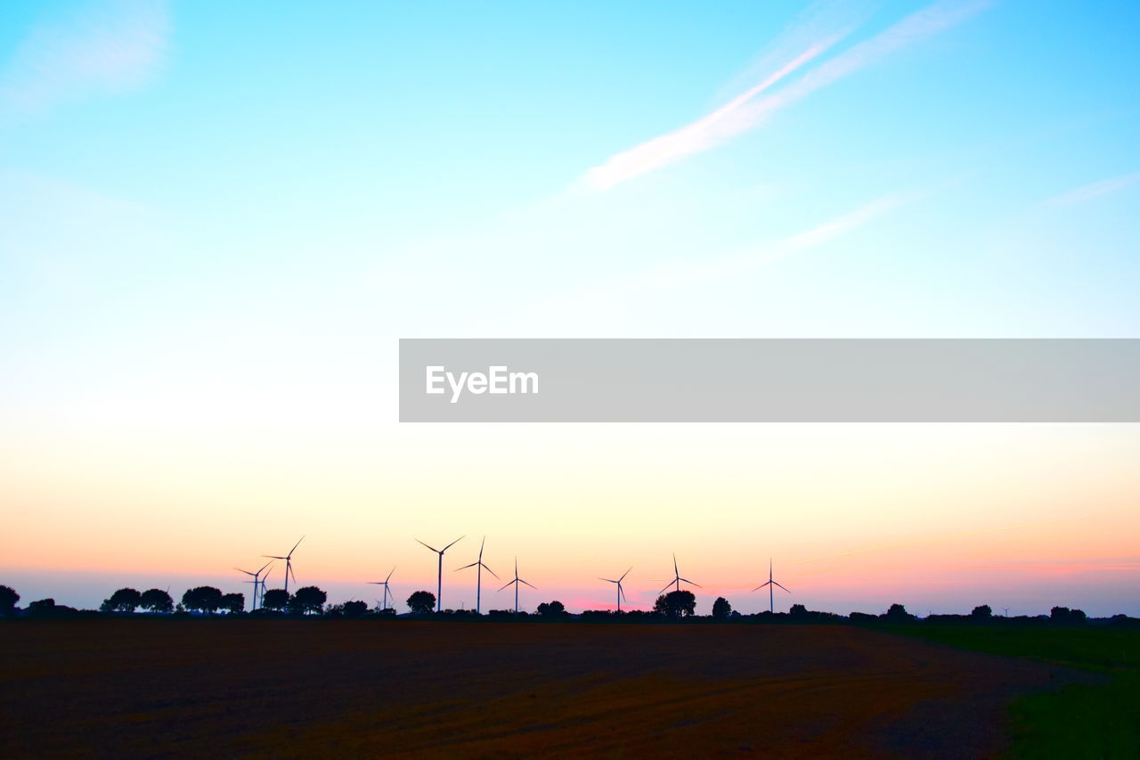 SCENIC VIEW OF SUNSET OVER LAND