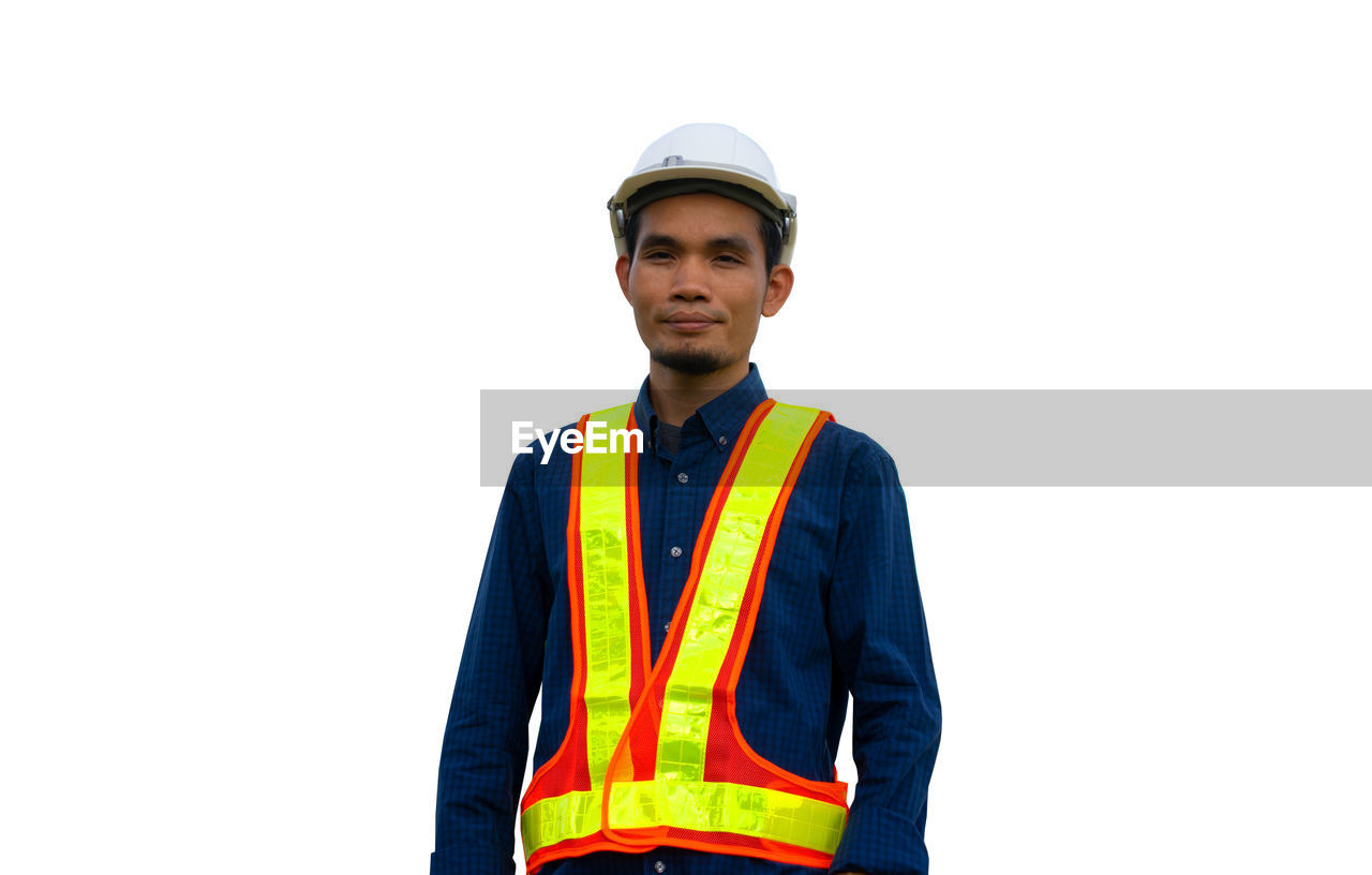 PORTRAIT OF MAN AGAINST WHITE BACKGROUND