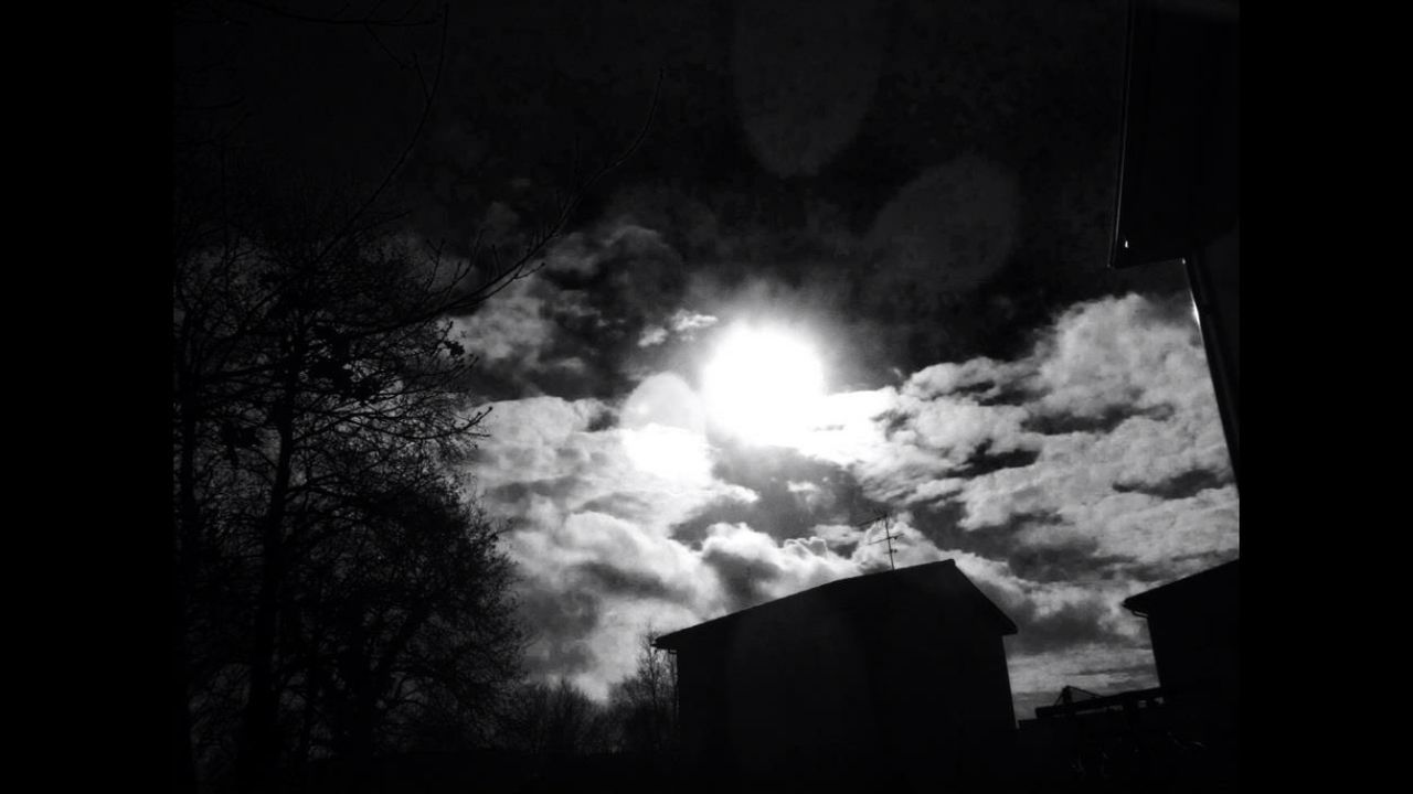 LOW ANGLE VIEW OF CLOUDY SKY OVER TOWN