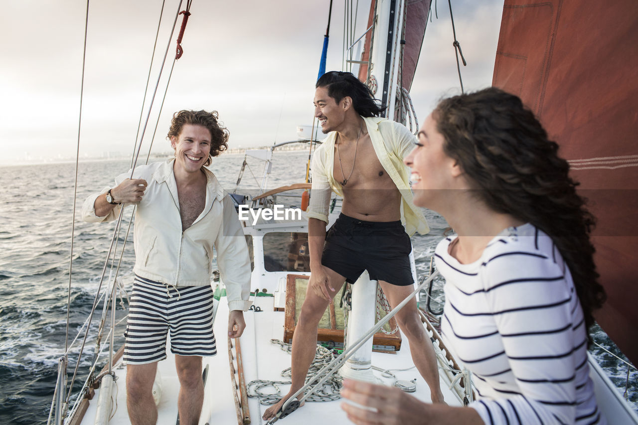 Friends enjoying on sailboat