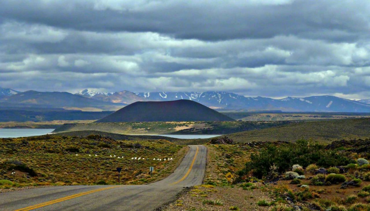 ROAD LEADING TOWARDS MOUNTAINS AGAINST SKY