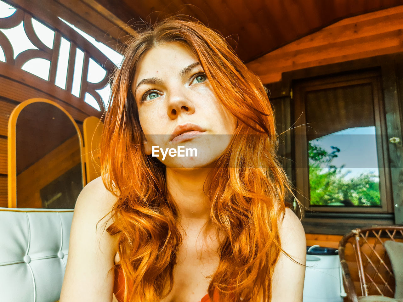 Portrait of beautiful young woman looking away