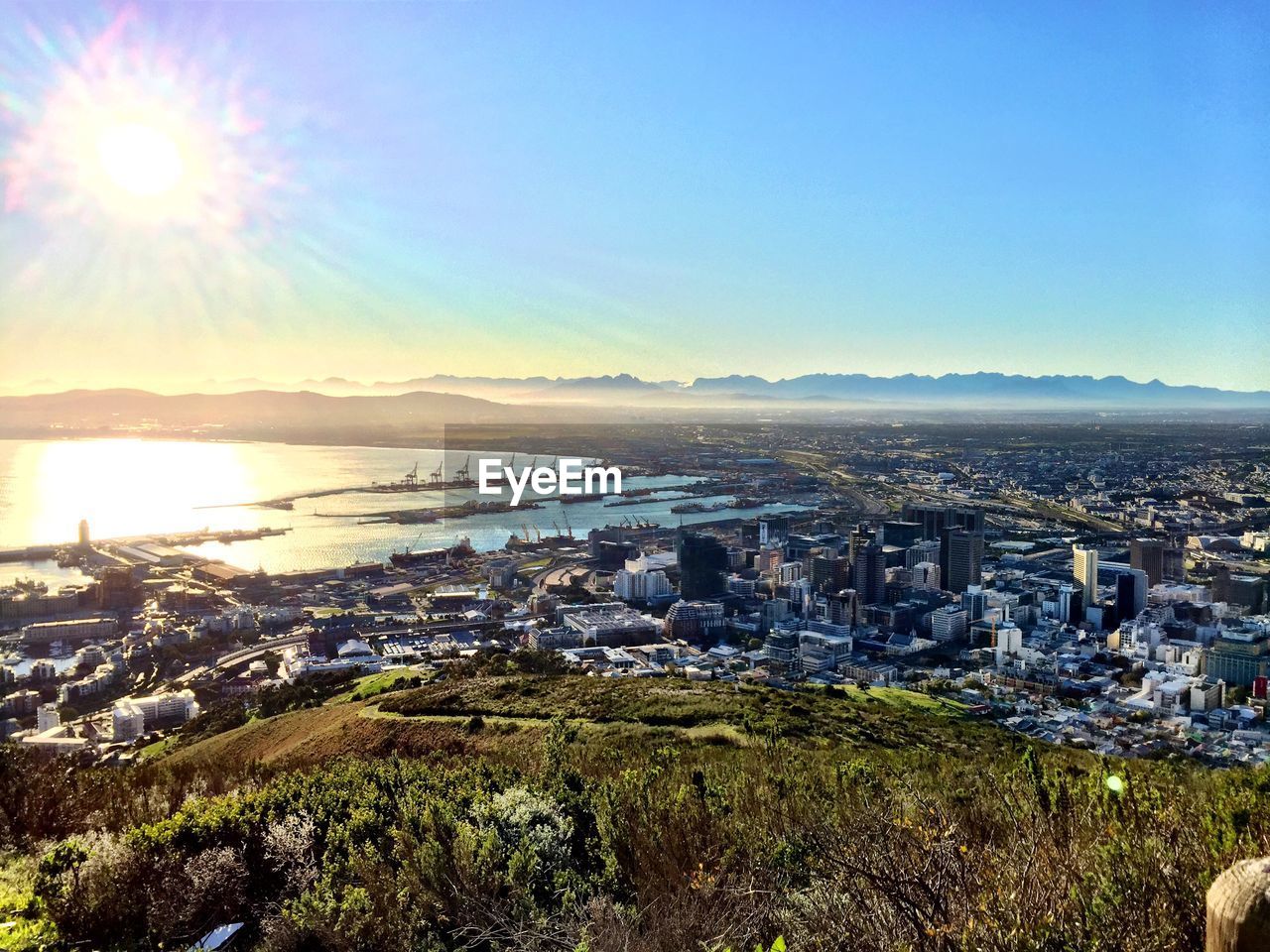 Cityscape against bright sky