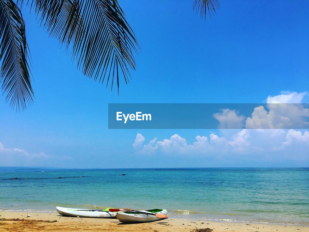 Scenic view of sea against blue sky