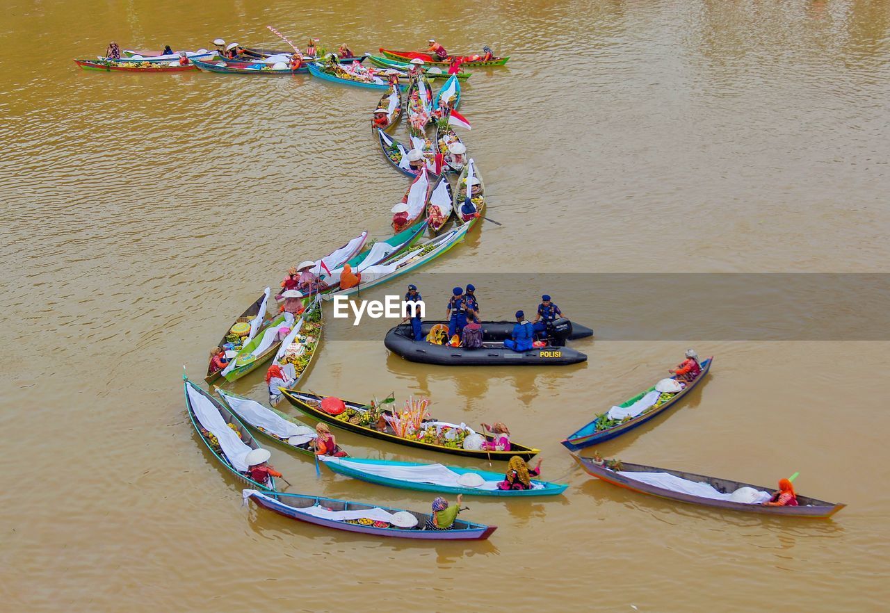 High angle view of people on boat in river