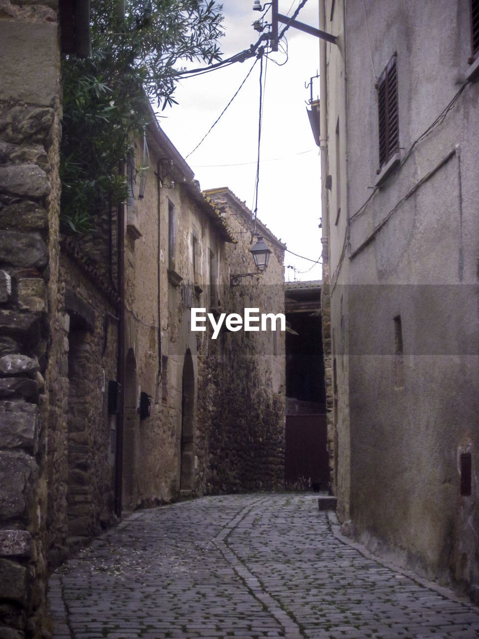 NARROW ALLEY ALONG OLD HOUSES