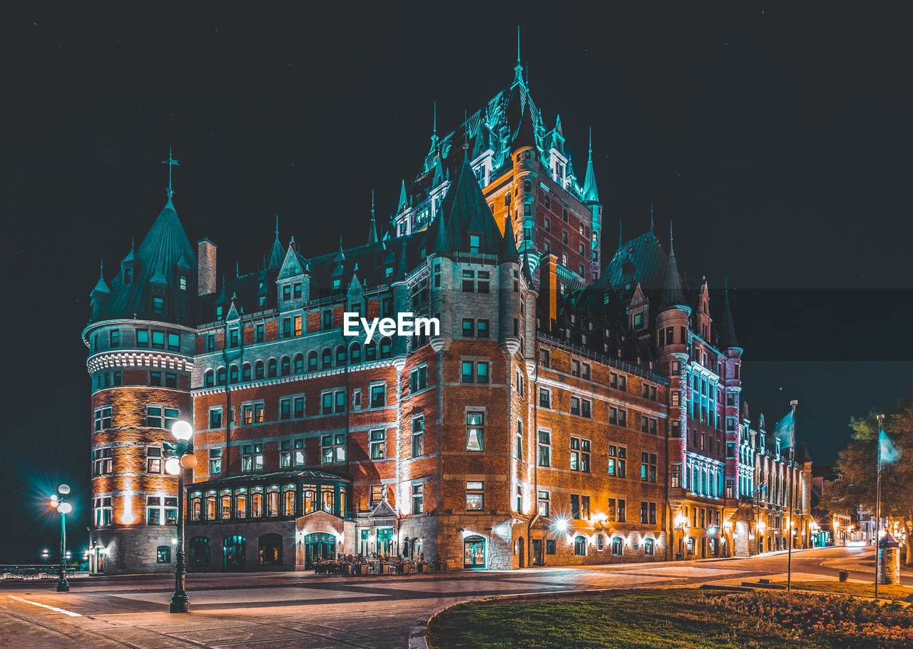 Illuminated buildings in city at night