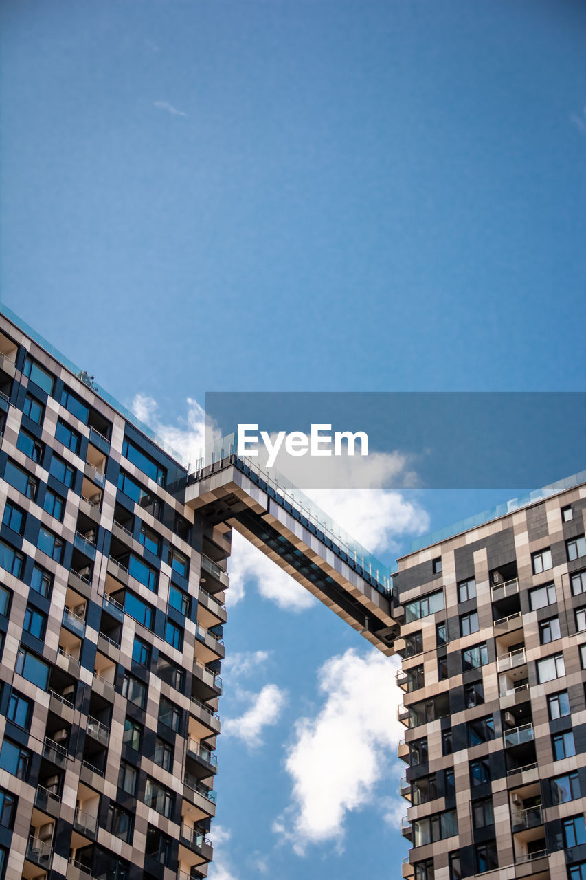 Low angle view of building against clear blue sky