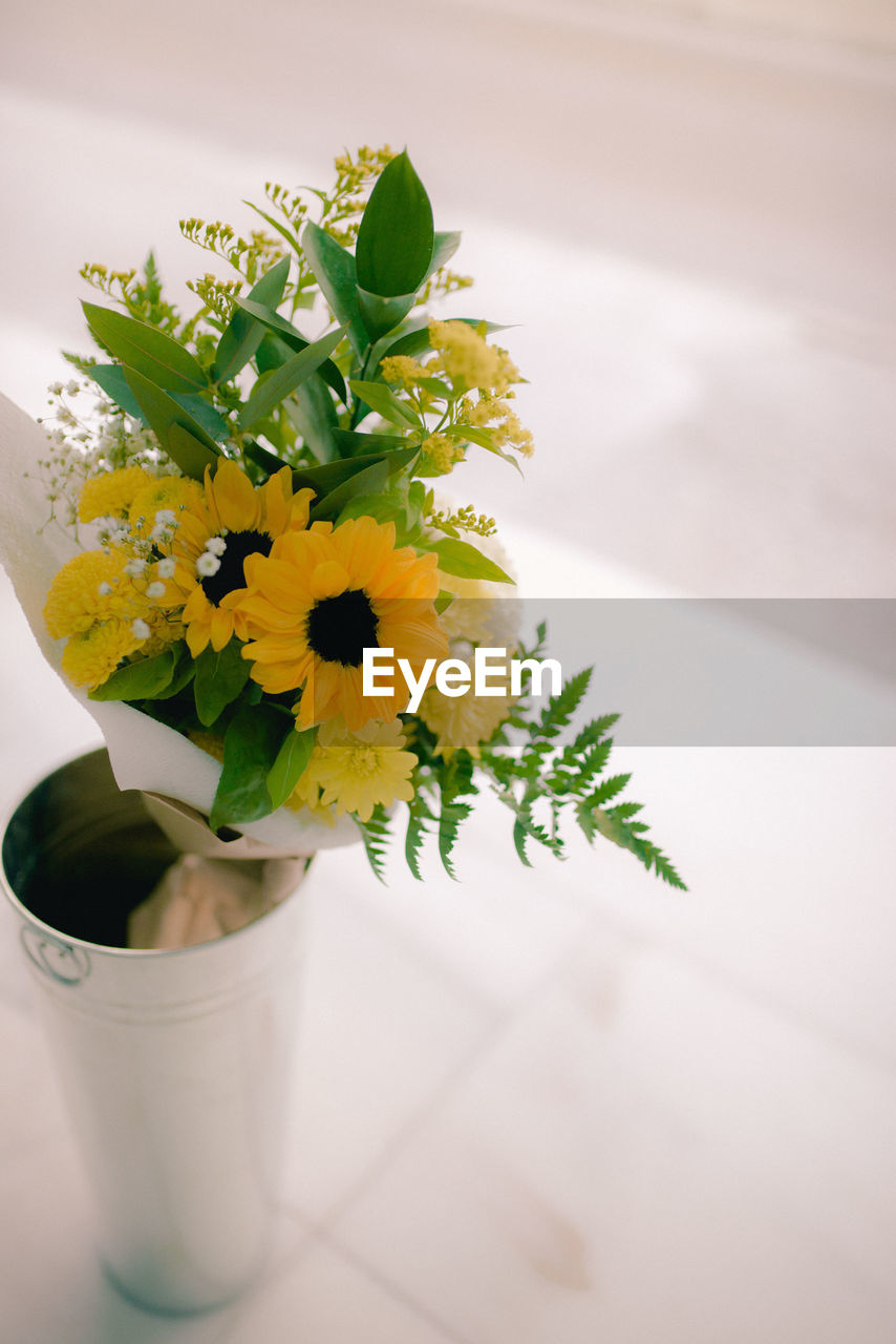 High angle view of white flower vase on table