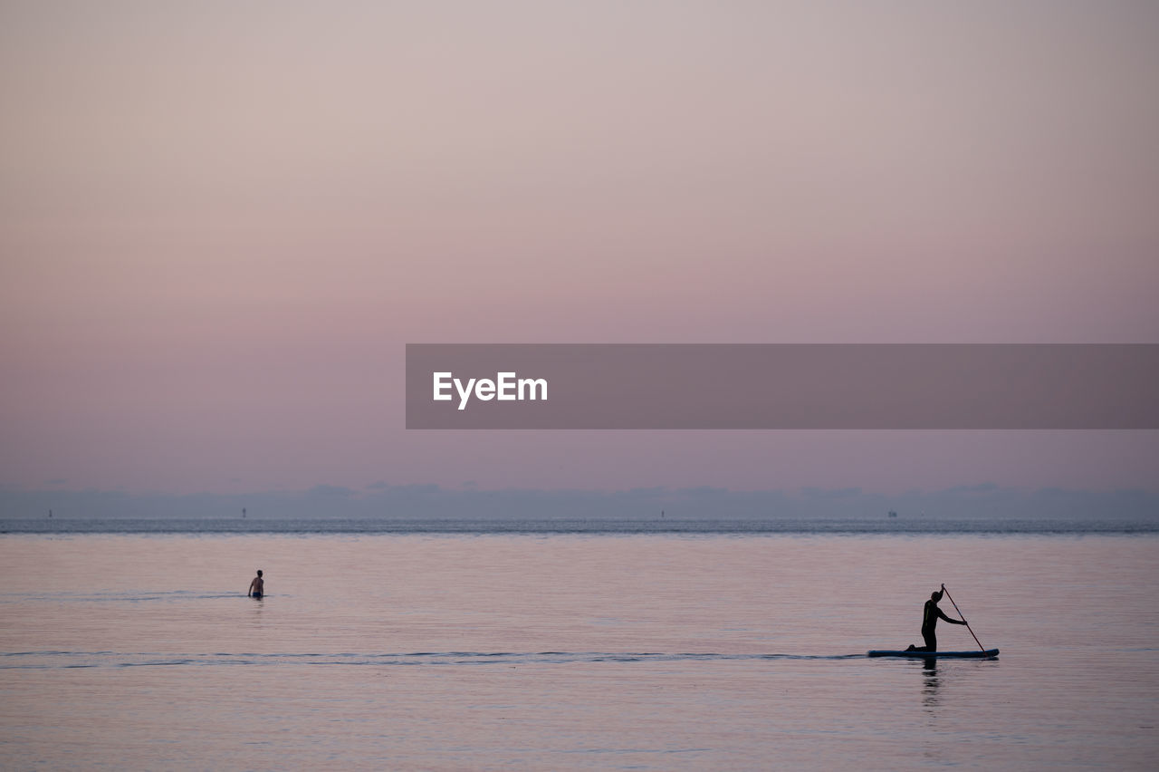 scenic view of sea at sunset