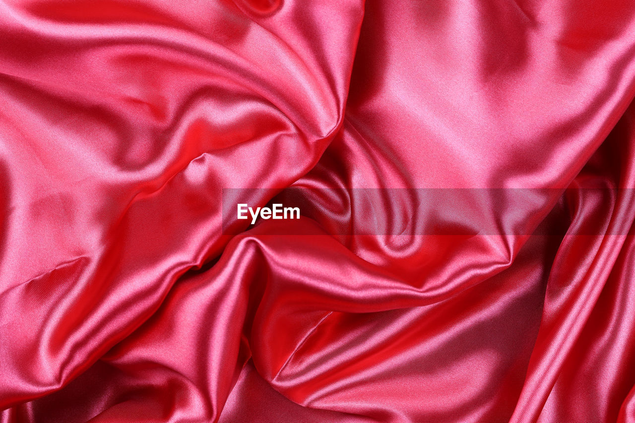textile, pink, red, satin, backgrounds, rippled, silk, full frame, crumpled, wrinkled, pattern, wave pattern, bed, sheet, petal, no people, smooth, luxury, textured, linen, folded, wealth, shiny, clothing, directly above, softness, abstract, curve, material, velvet, indoors, elegance, magenta, high angle view, maroon, studio shot