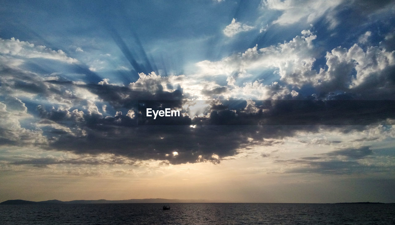 VIEW OF SEA AGAINST CLOUDY SKY