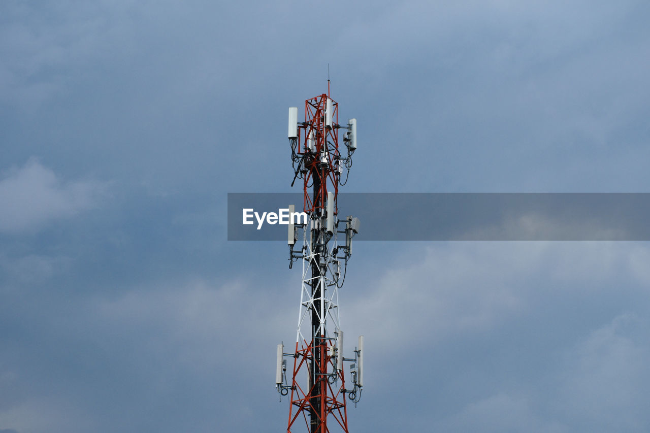 Low angle view of tower against cloudy sky