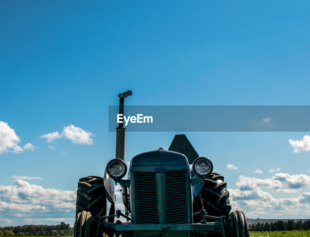 Old tractor against blue sky