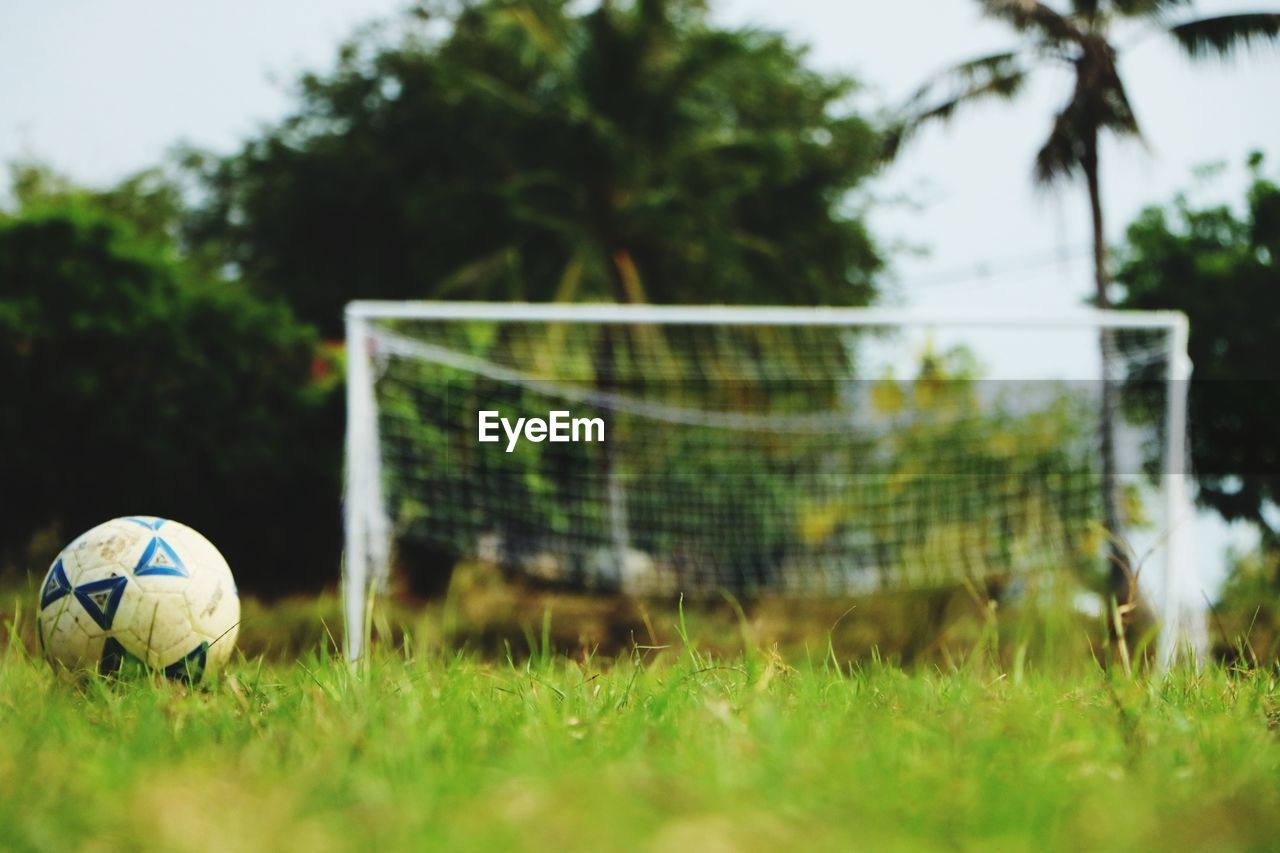 Close-up of soccer ball on field