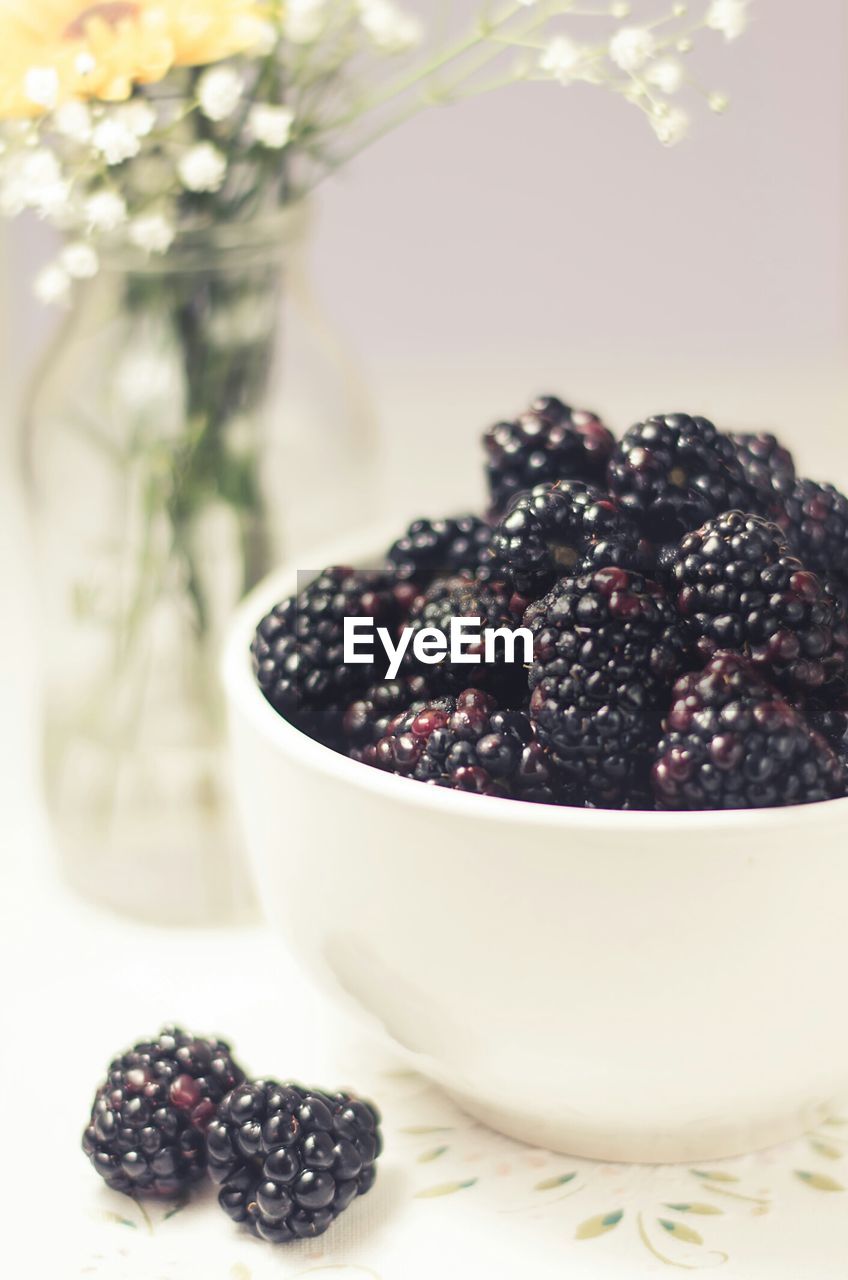 Close-up of blackberries served on table