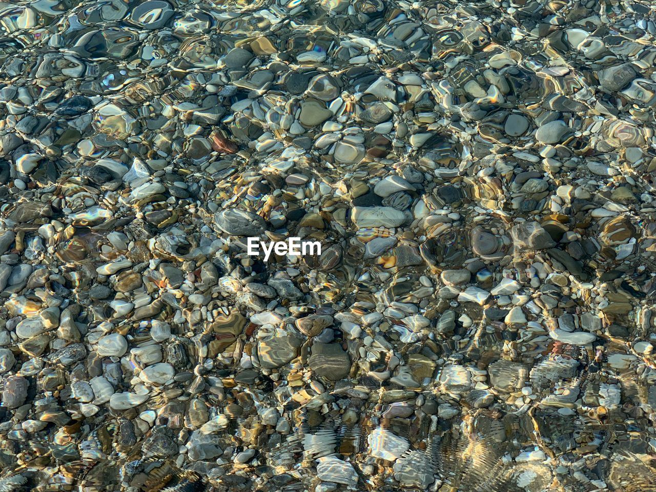 High angle view of stones on beach