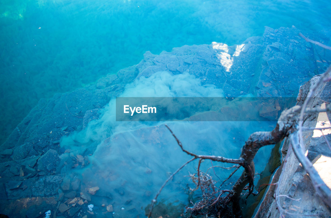 High angle view of rocks in sea