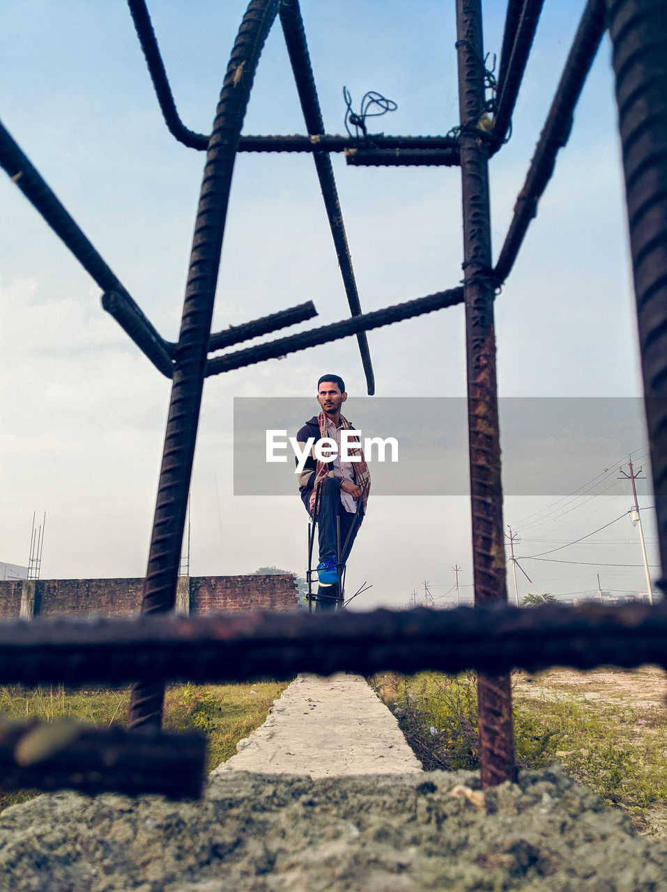 Young boy portrait from metal rods