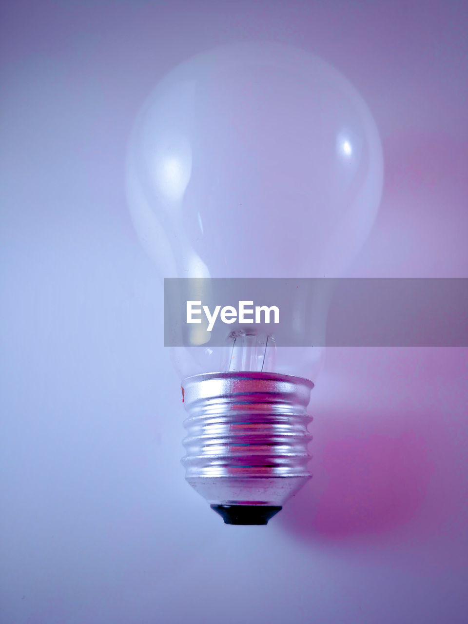 Close-up of light bulb on table