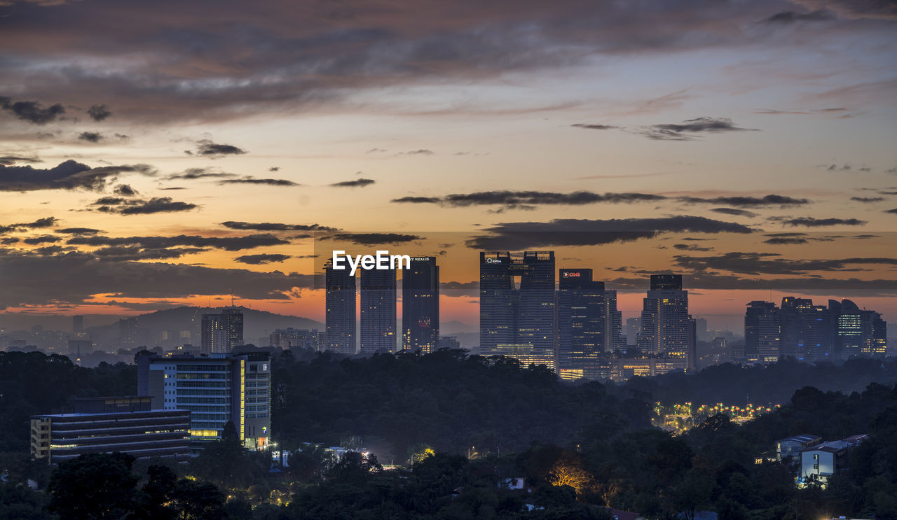 High angle view of buildings against sky during sunset