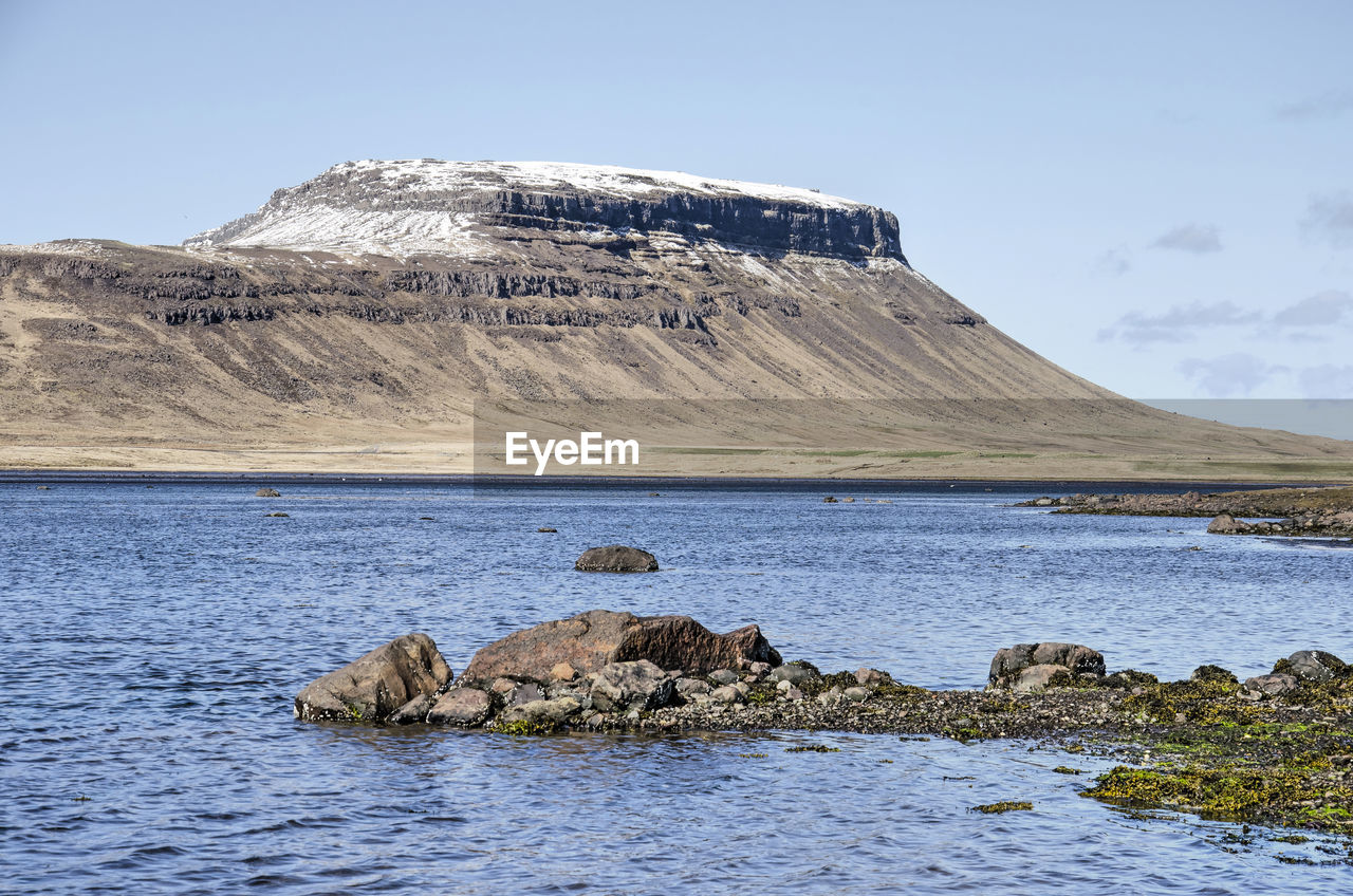 View across a fjord on the northern shorer of snaefellsness peninsula towards a snow-capped mountain