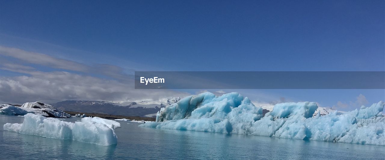 Scenic view of frozen lake against sky