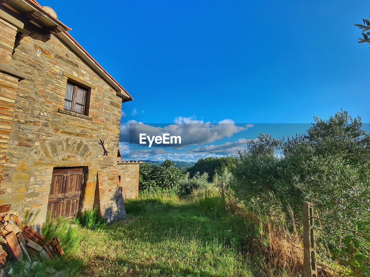 Low angle view of abandoned building against sky