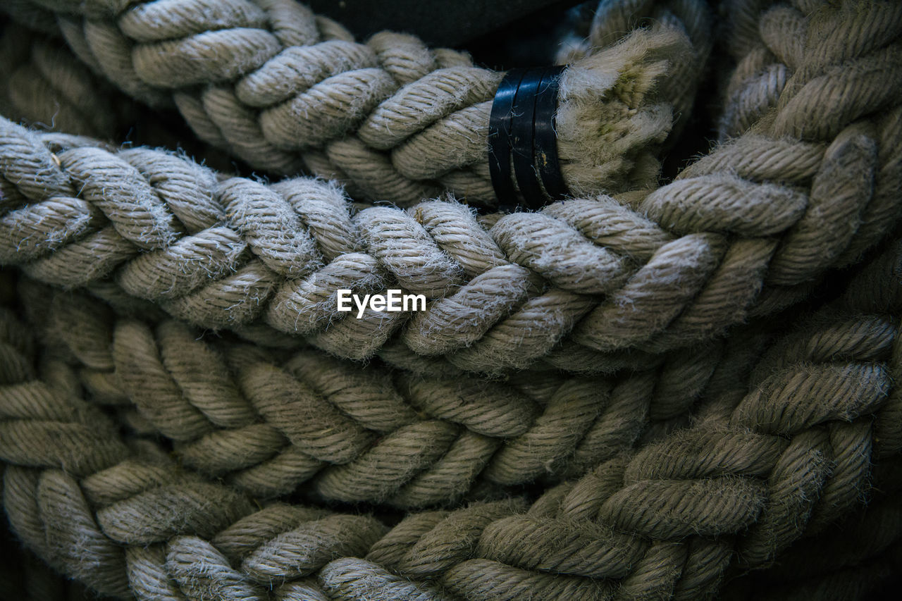 Close-up of coiled up rope in boat