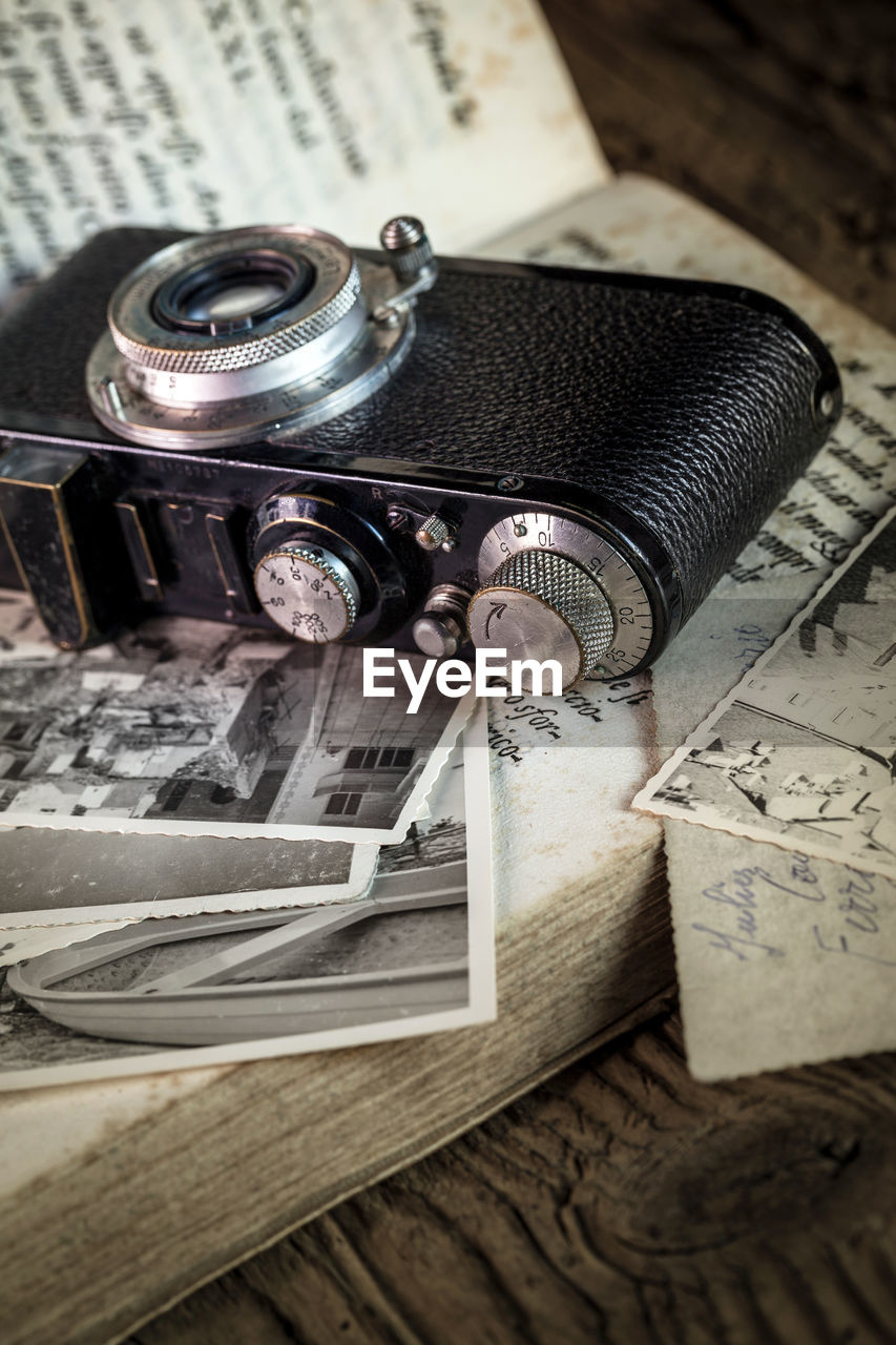 CLOSE-UP OF OLD CAMERA ON TABLE