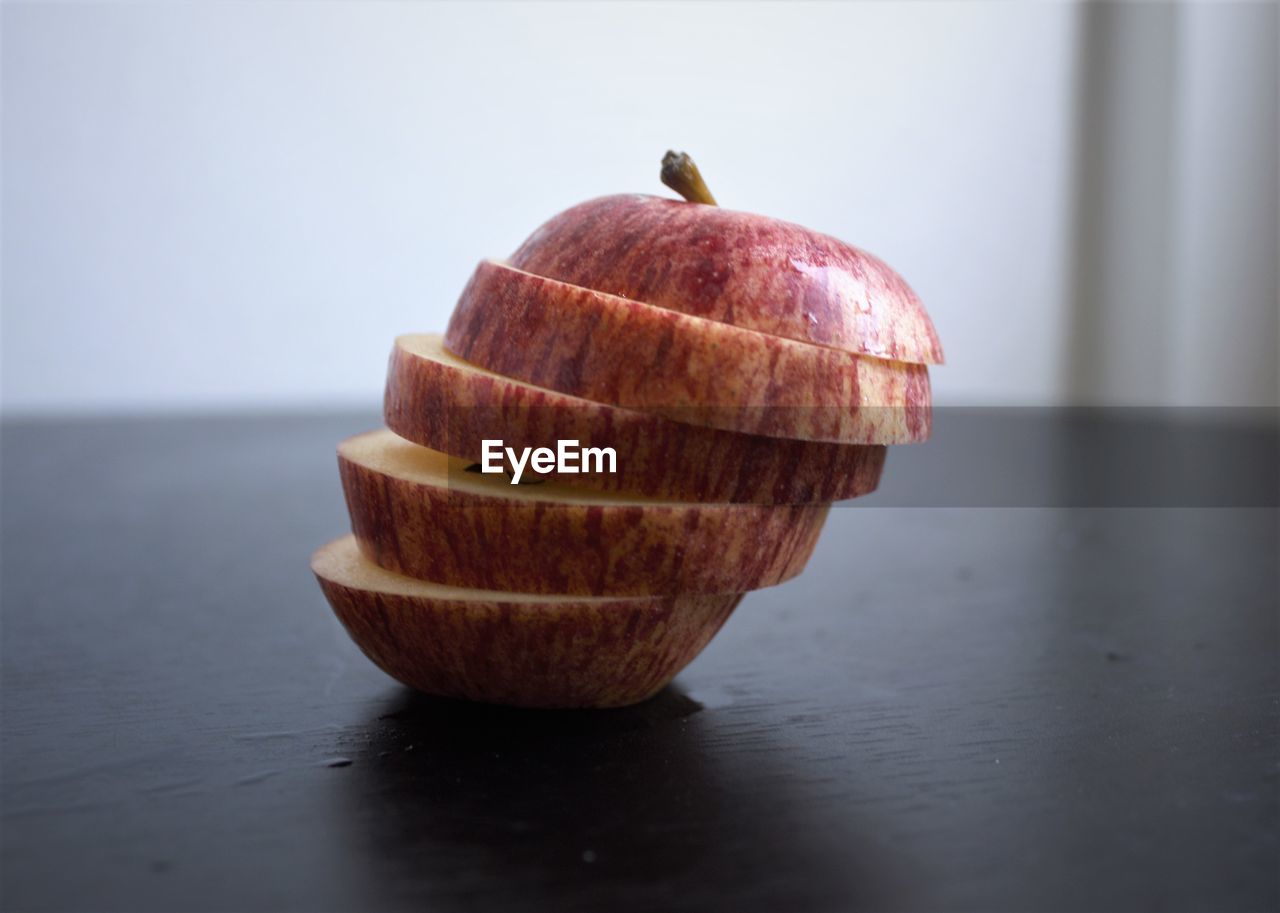 CLOSE-UP OF APPLES ON TABLE