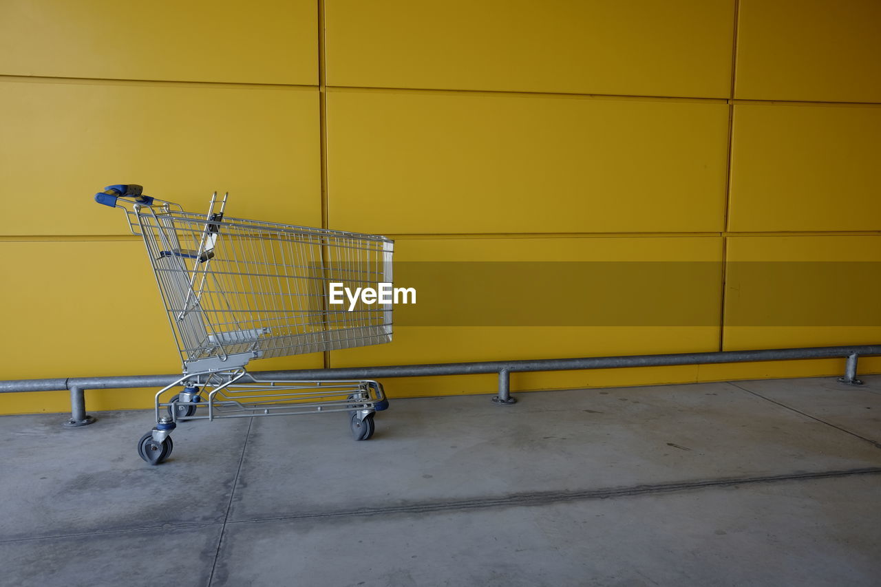 Shopping cart by wall