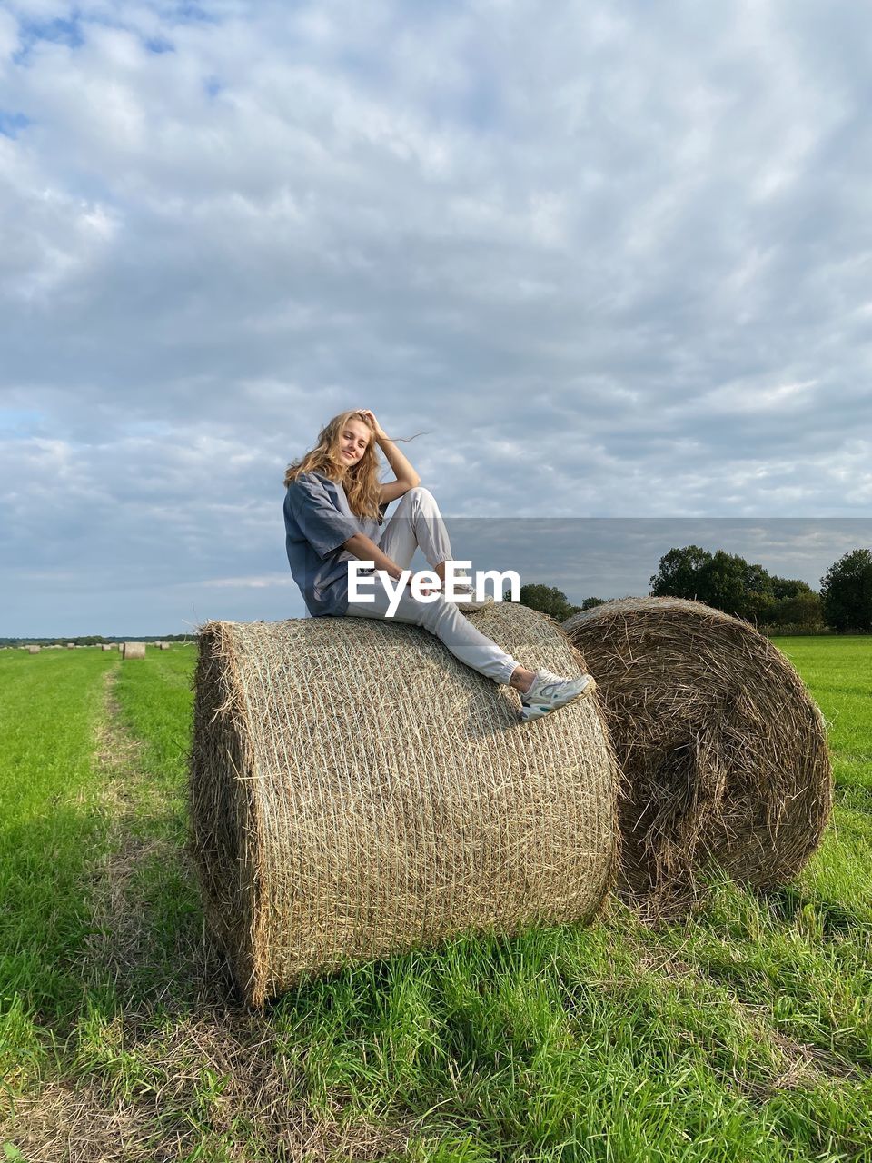 rear view of woman standing on field