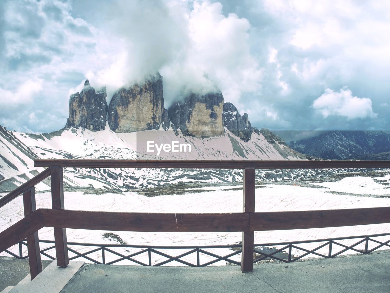 Breathtaking view from mountain hut terrace to symbol of italian dolomites - tre cime. rocky ridge