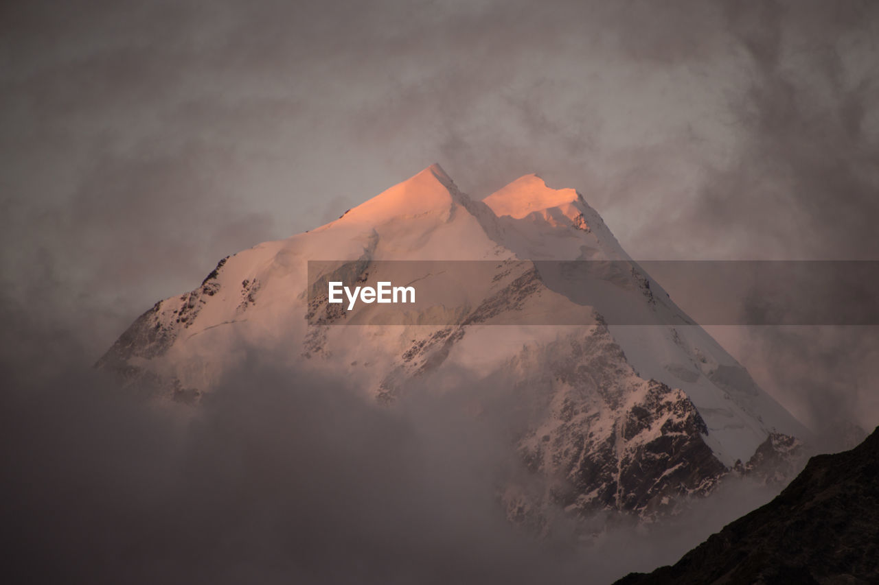 AERIAL VIEW OF VOLCANIC MOUNTAIN AGAINST SKY