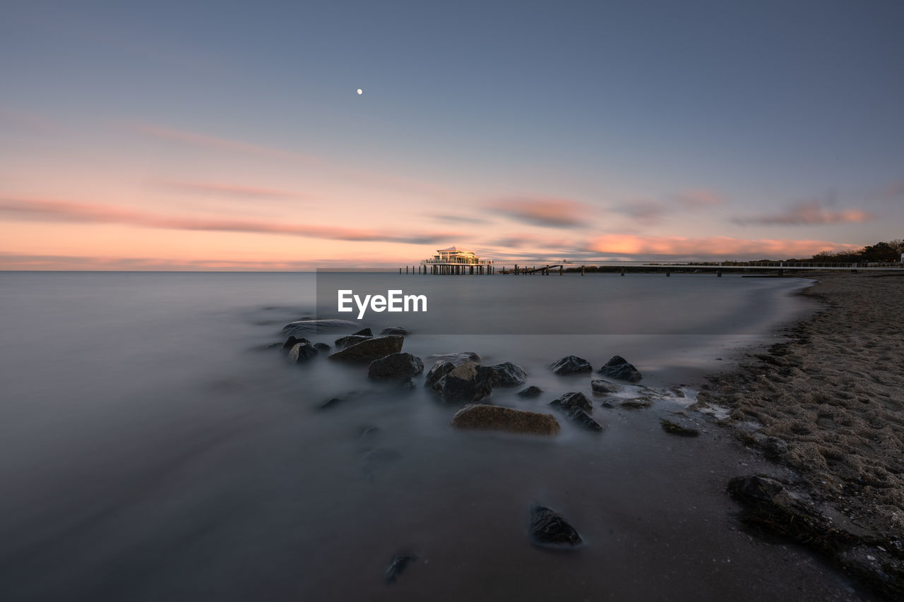 SCENIC VIEW OF SEA DURING SUNSET