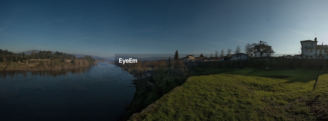 SCENIC VIEW OF RIVER AMIDST TREES AGAINST SKY