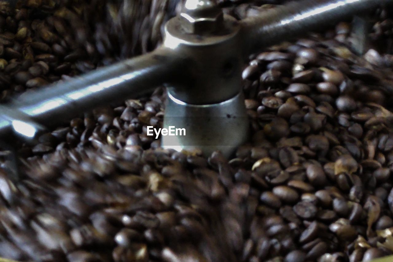 CLOSE-UP OF COFFEE BEANS IN GLASS