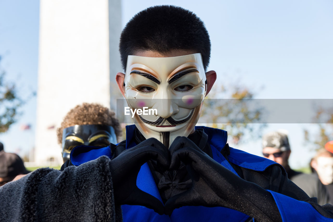 CLOSE-UP OF WOMAN WITH MASK