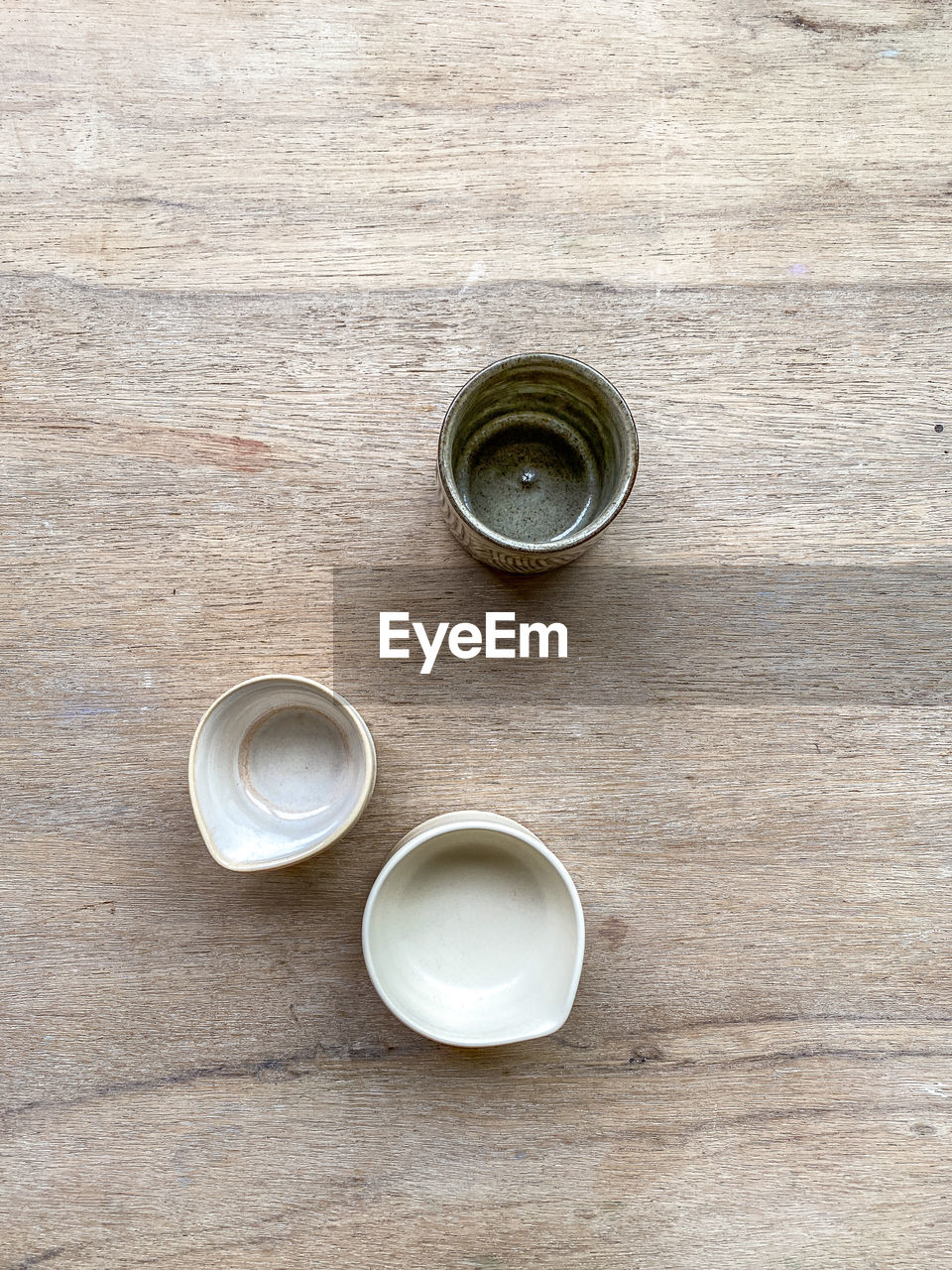 drink, food and drink, wood, table, refreshment, cup, high angle view, directly above, mug, coffee cup, still life, no people, indoors, coffee, hot drink, crockery, tea, food, jewellery, silver, tableware, circle, fashion accessory, ceramic, household equipment, freshness