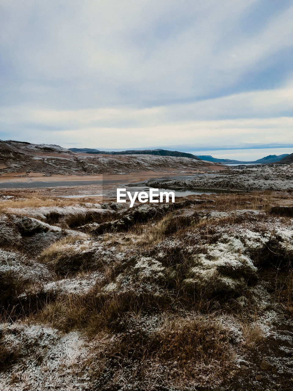 sea, sky, environment, landscape, scenics - nature, coast, cloud, rock, nature, land, beauty in nature, natural environment, tranquility, wilderness, shore, no people, sand, non-urban scene, tranquil scene, winter, day, snow, ocean, water, geology, mountain, wave, outdoors, tundra, travel destinations, travel, remote, horizon, tourism, cold temperature, wetland, plateau